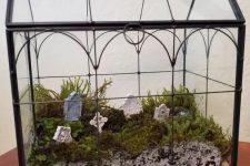a large Halloween terrarium with pebbles, moss and a graveyard is a cool solution, it won’t take long to make