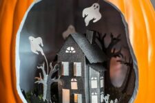 a lovely Halloween diorama with a black paper house with trees and a fence, moss and ghosts is a gorgeous idea to try
