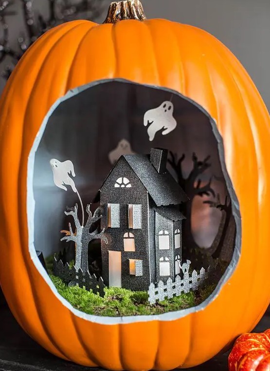 a lovely Halloween diorama with a black paper house with trees and a fence, moss and ghosts is a gorgeous idea to try