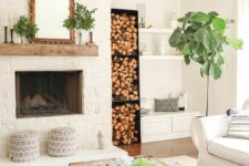a cozy living room with a firewood niche
