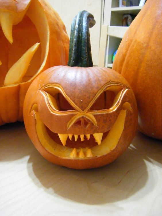 a scary monster carved pumpkin will be a nice Halloween decoration, for both indoors and outdoors