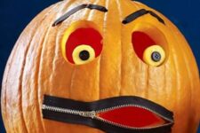 a simple carved pumpkin with a bit of details – button eyes, eyebrows and a zip mouth is a nice and fast to make DIY for Halloween