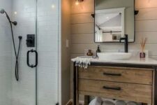 a cozy bathroom with a wooden vanity
