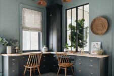 a stylish double modern farmhouse home office with light blue walls, navy desks, stained chairs, a woven basket and greenery
