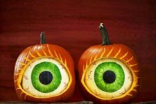 jaw-dropping scary eye pumpkins composed of orange and white ones with decor inside will strike everyone