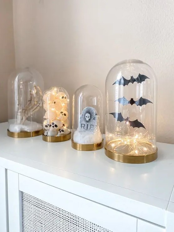modern Halloween cloches with bats and lights, a tombstone, skulls and a skeleton hand are amazing