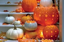 pumpkins carved in beautiful ways are beautiful and catchy Halloween candle lanterns and can decorate both indoor and outdoor spaces