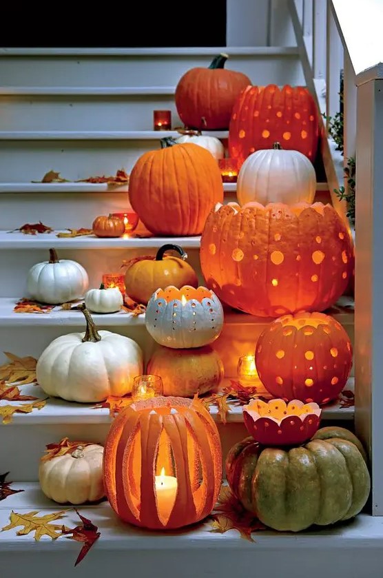 pumpkins carved in beautiful ways are beautiful and catchy Halloween candle lanterns and can decorate both indoor and outdoor spaces