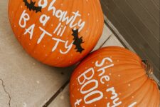 pumpkins with some quotes written with paint and bats and ghosts are nice for Halloween decorating