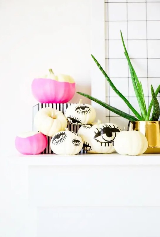 hot pink color block and eye pumpkins can be made with paint and a sharpie easily for a modern Halloween party