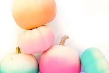 14 an arrangement of bold ombre pumpkins for Halloween and just for fall will give a touch of bright color and create a mood in the space