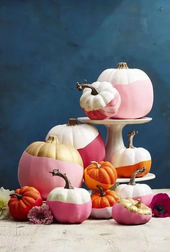 modern color block Halloween pumpkins in white, pink, burgundy, gold and orange is a great idea for bold Halloween decor
