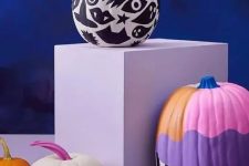 29 a black and white painted pumpkin and a colorful one will be a nice idea for Halloween