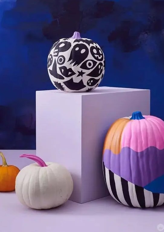 a black and white painted pumpkin and a colorful one will be a nice idea for Halloween