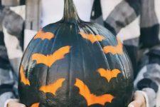 30 a black pumpkin stenciled with bats is a great idea for a modern rustic party or for your porch and it’s easy to make