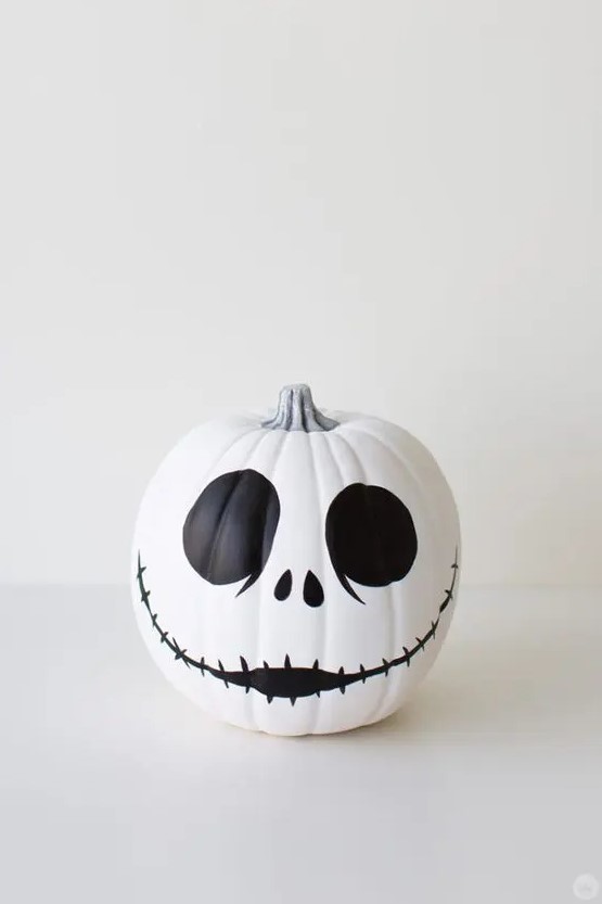 a classic Jack Skellington pumpkin in black and white is easy to make with paint and maybe a sharpie