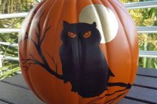 34 a painted Halloween pumpkin with a moon and an owl is a cool and bold decoration, and you need only some paint