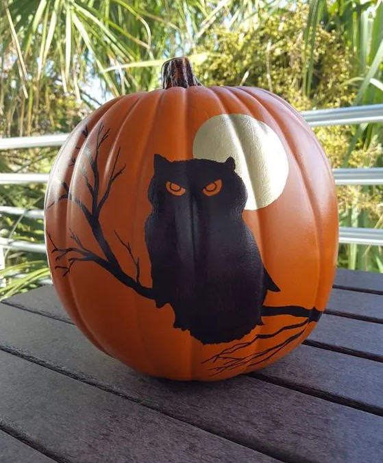 a painted Halloween pumpkin with a moon and an owl is a cool and bold decoration, and you need only some paint