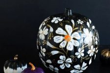 35 a refined black floral pumpkin isn’t a very easy craft but it looks very chic and will be great for Halloween