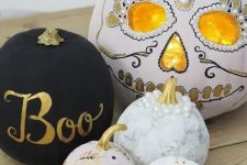 38 an arrangement of beautiful pumpkins – a matte black one, patterns ones and a gorgeous sugar skull styled pumpkin to finish off