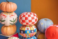 52 colorful painted pumpkins with patterns and flowers are great for gall and Halloween decor