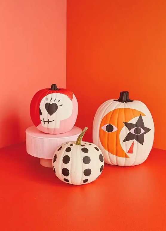 bold painted Halloween pumpkins are a super cool solution, and you don't have to be an artist to make them