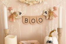 a Halloween banner with letters, little felt pompoms and stars is a cool solution for pastel Halloween decor