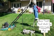 a Halloween outdoor space with a skeleton on the grass plus a skeleton dog is a cool and fun idea for this holiday