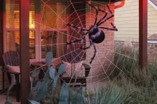 a lovely spider-themed outdoor decor idea