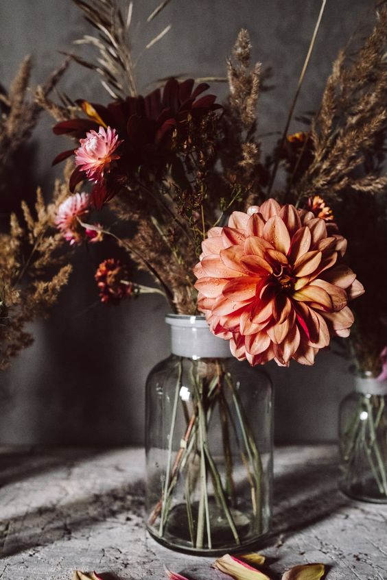 a bright and eye-catching faux and dried flower arrangement is a cool centerpiece for the fall