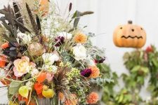 a cool halloween centerpiece with dried flowers