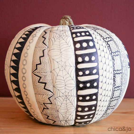 a cathcy black and white pumpkin decorated with a sharpie for Halloween is a super cool idea