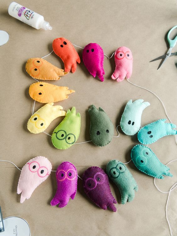a colorful plush ghost garland will be a cool idea for Halloween kids' decor, it will add color and fun
