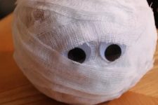 a cool mummy pumpkin with googly eyes is a lovely decoration for Halloween that you cna make with your kids