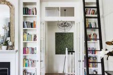 a doorway surrounded with open storage compartments that are used for book storage is a great idea for saving space