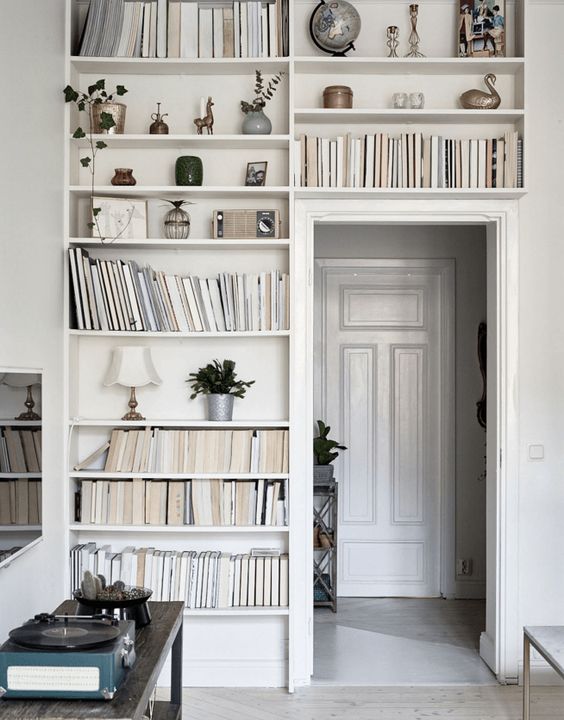 A doorway with built in bookshelves, with books and other stuff is a lovely idea for any home, use this dead space