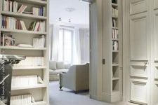 a doorway with built-in open shelves on both sides and over the door is a smart idea to store books and not to place a boring bookshelf somewhere