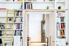 a doorway with open shelves, a ladder to get books is a lovely idea to create a lightweight bookcase that won’t take much space