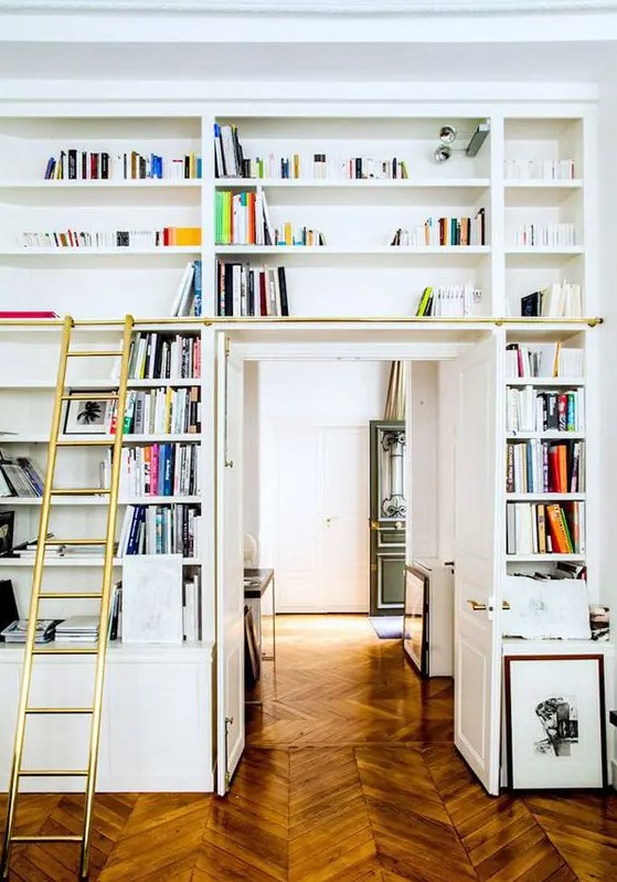 a doorway with open shelves, a ladder to get books is a lovely idea to create a lightweight bookcase that won't take much space