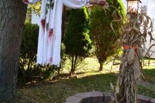a flying demon girl attached between a tree and a pole is a cool idea for Halloween decor
