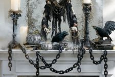 a large antique mirror with a skeleton wearing a capelet is a super creative and bold idea for styling your space for Halloween