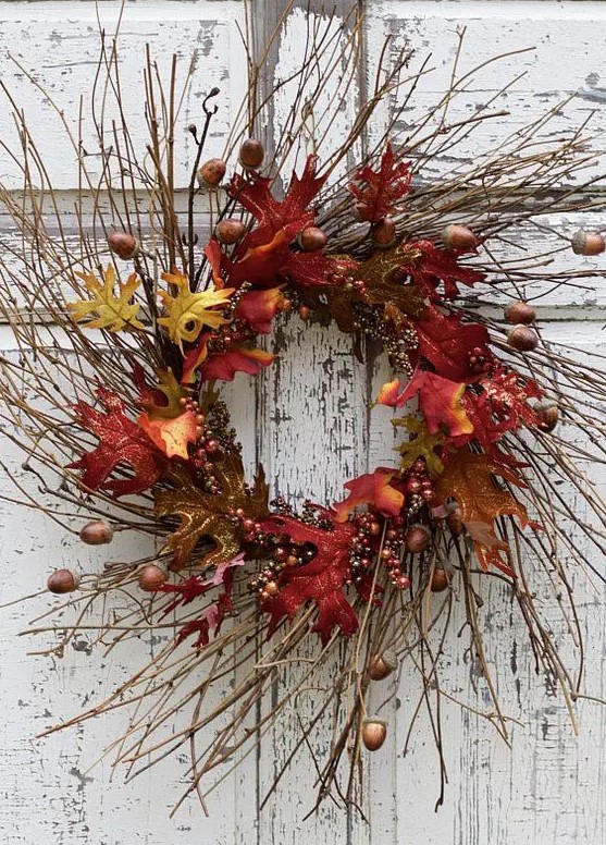 a lush twig fall wreath with bright faux leaves, acorns and berries will bring much color to the porch