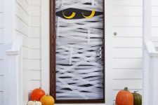 a lovely front door decorated for Halloween
