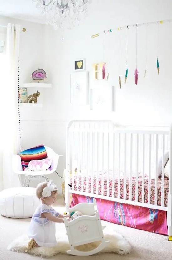 a neutral nursery spruced up with bold colors, with modern white furniture, colorful textiles and toys is a pretty and lovely kid's space