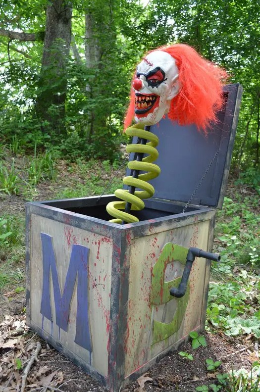 a scary Halloween yard decoration of a metal box and a clown is a cool and bold idea, and it will scare those IT fans to death