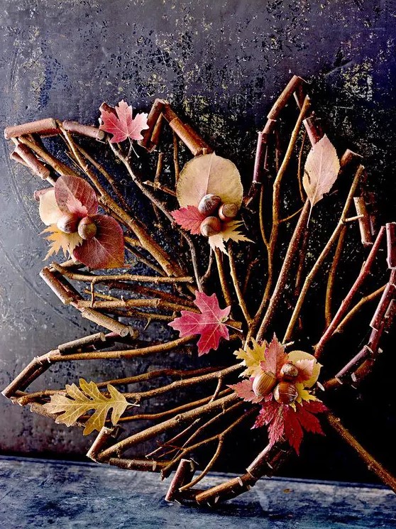a stick and twig leaf with leaves and acorns is a lovely and easy fall decoration you can make