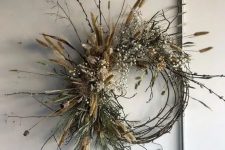 a vine and twig fall wreath with willow, greenery, baby’s breath and dried touches will last long