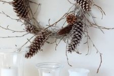 a vine and twig wreath with pinecones is a lovely and all-natural fall to winter decoration