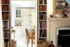 a vintage space with open bookshelves over the doorway is a lovely idea to store books and make the space look cool and chic