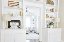 a white modern farmhouse storage unit with a shelf over the doorway to get more space for displaying